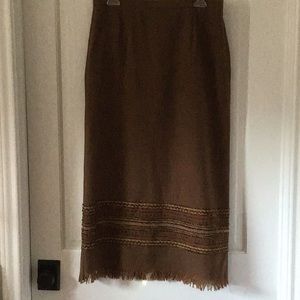 Cocoa brown with orange, gold and brown intricate trim perfect boot skirt.